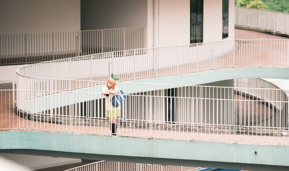 Cosplay enthusiast posing on a modern architectural walkway, creating a unique urban visual.