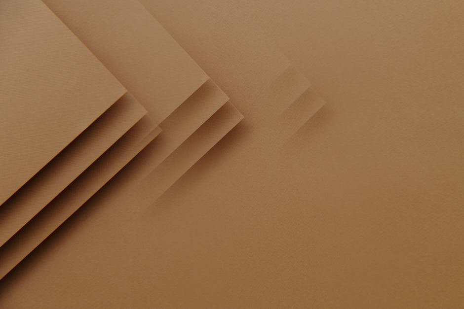 Abstract textured brown background with layered paper effect, perfect for design copyspace.