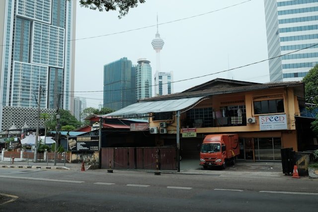 a red truck parked in front of a building