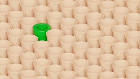 A green object in the middle of a group of white objects
