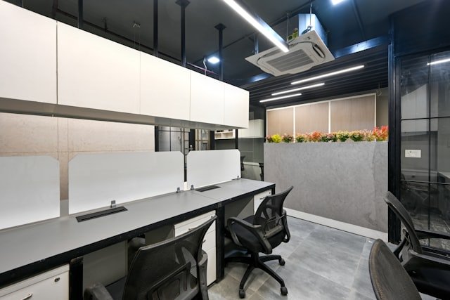 a conference room with a table and chairs